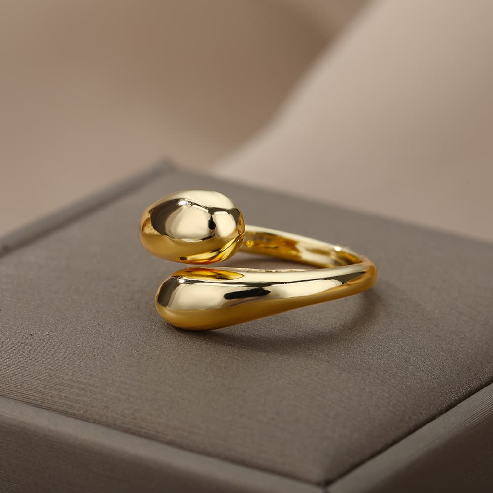 Anillo geométrico retro plateado y dorado