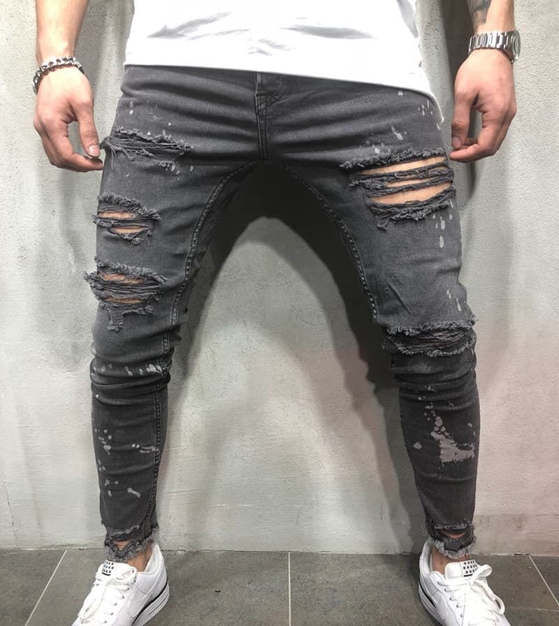 Pantalones vaqueros ajustados con desgarre y pliegues para hombre