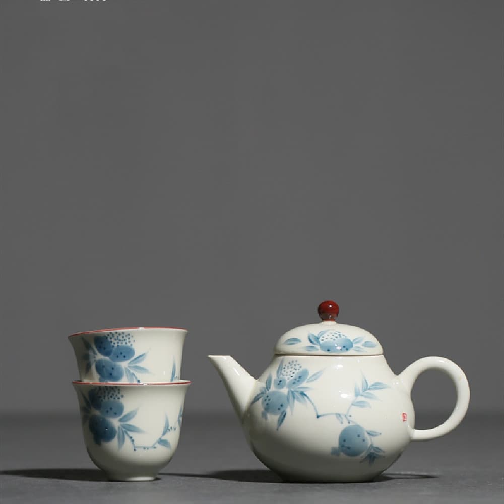 Set de té con tetera pintada a mano con diseño de granada
