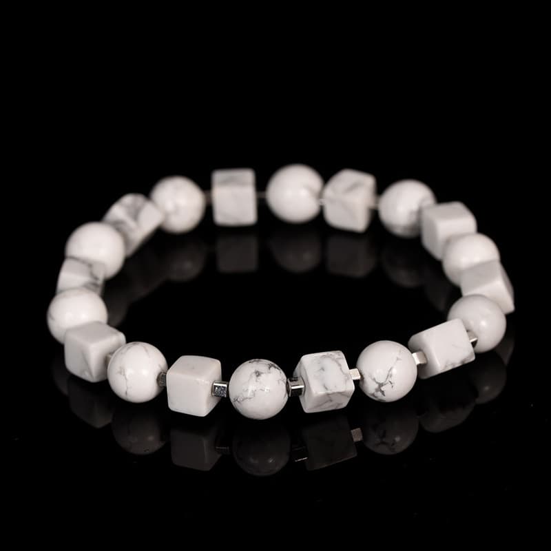 Pulsera elástica de cristal con cubos y perlas doradas