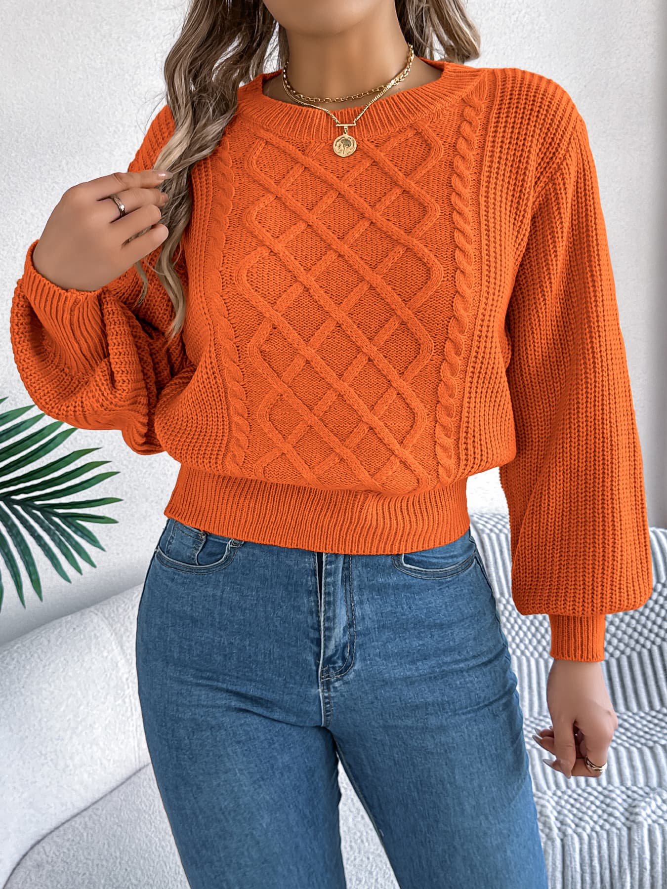 Suéter pullover de punto cable y mangas linterna