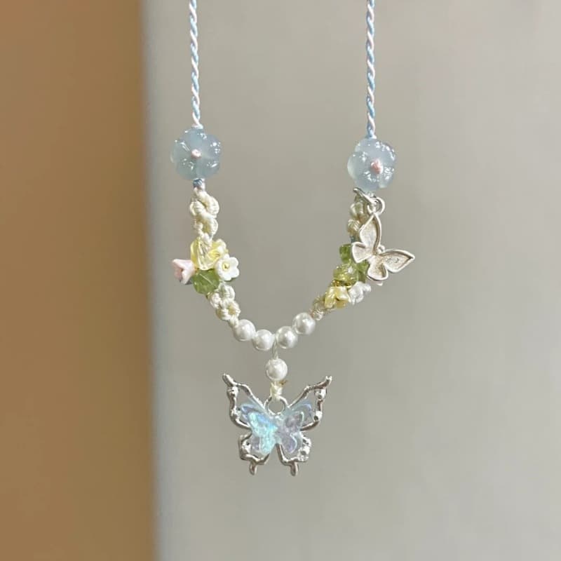 Collar de cordón tejido con mariposa cristal azul para mujeres