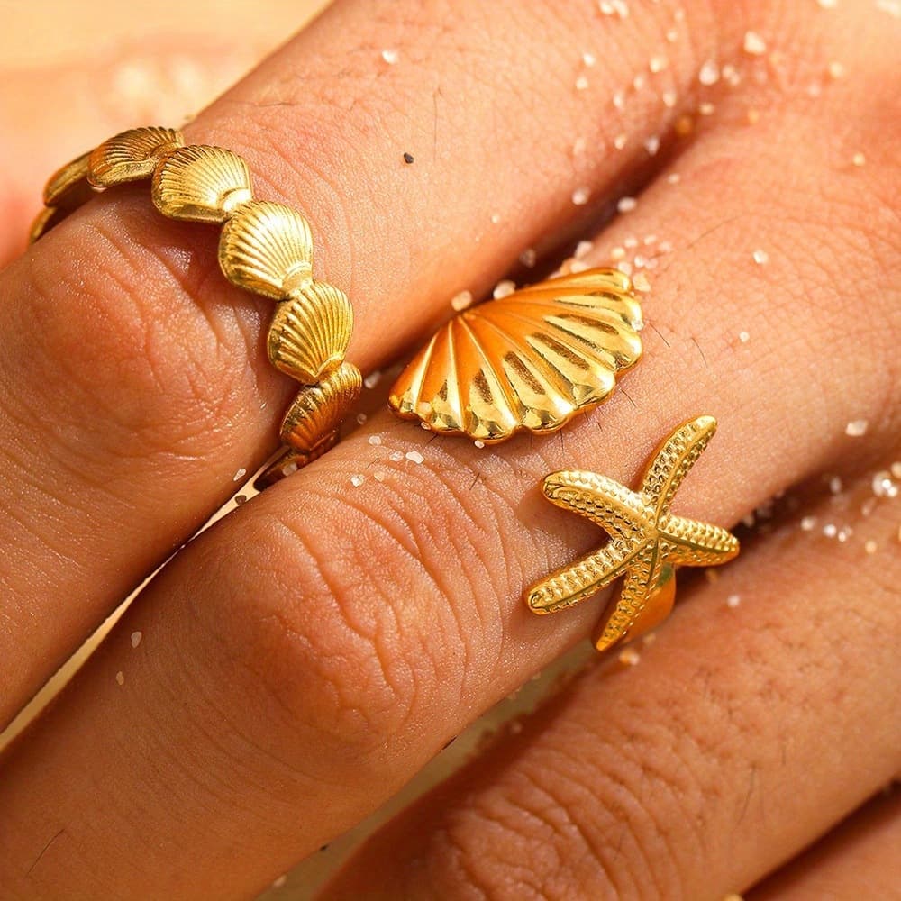 Anillo de acero de titanio con estilo oceánico y estrella marina