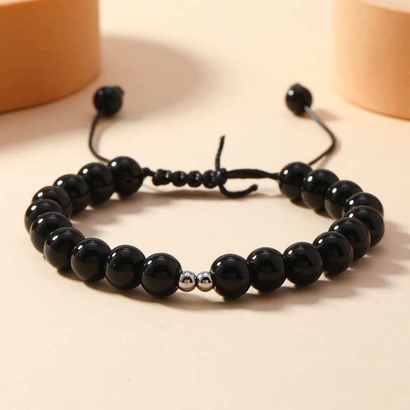 Pulsera de cristal con borla y diseño elegante