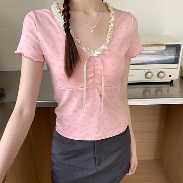 Blusa de algodón floral con cuello en V y encaje