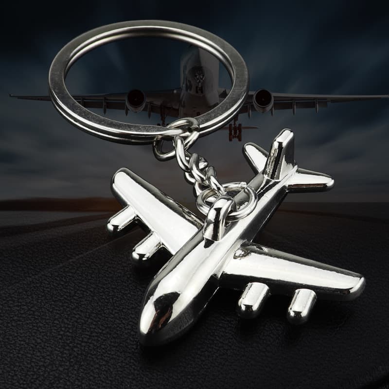 Llavero metálico en forma de avión