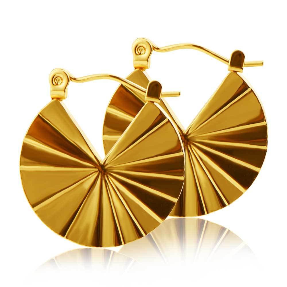 Aretes de titanio con forma de concha dorados