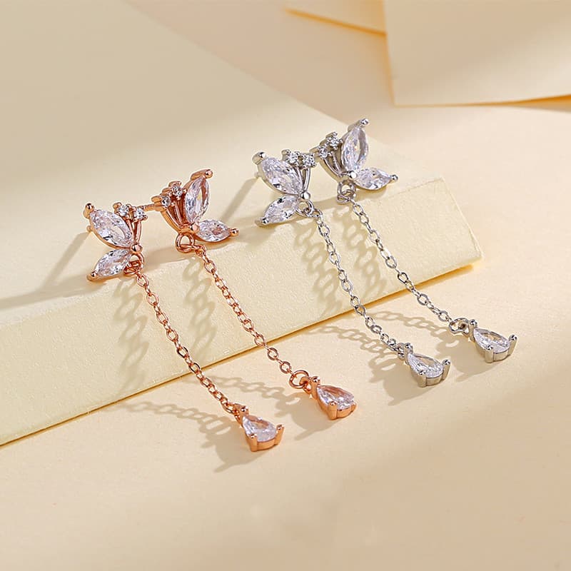 Aretes de mariposa con circonita y borla de plata