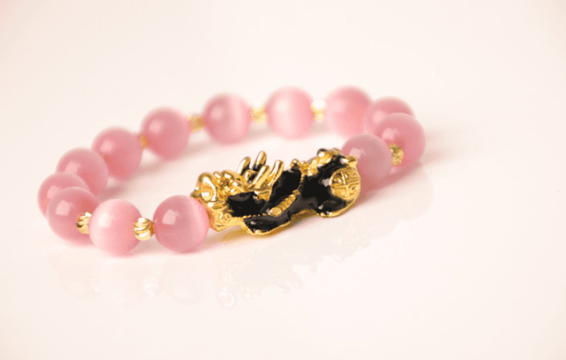 Pulsera de cristal 3D dorada con Pixiú termosensible