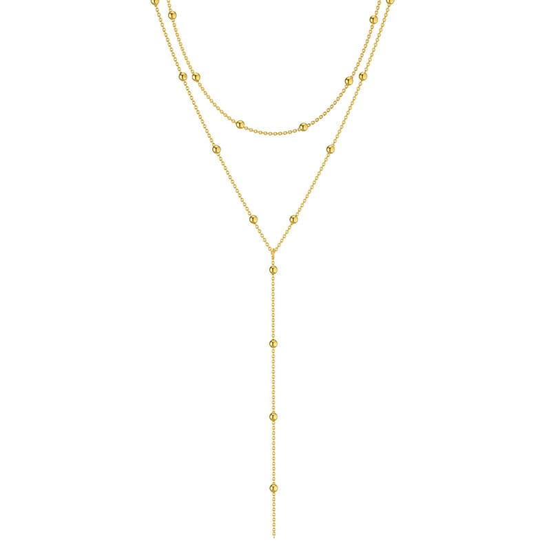 collar largo con colgante geométrico y borla