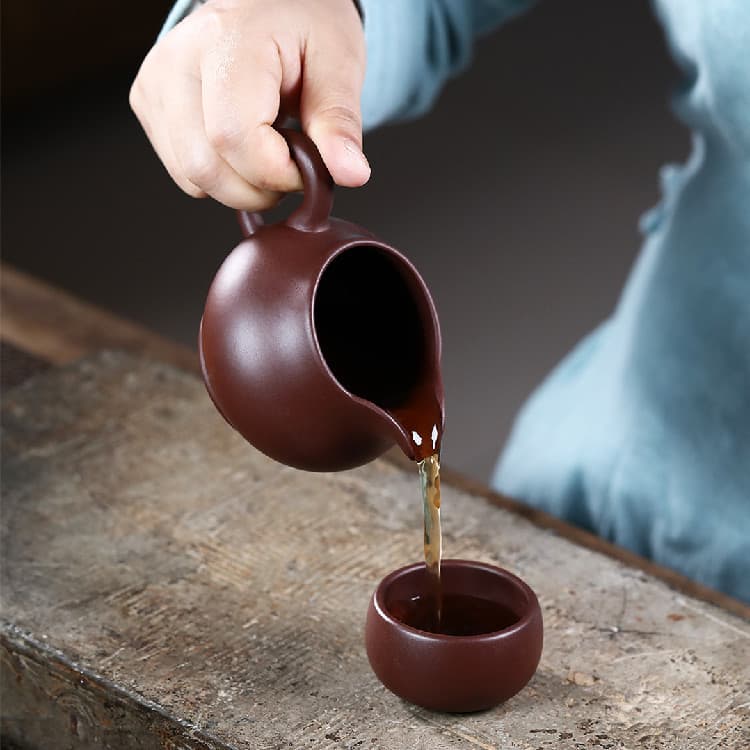 Tetera de arena púrpura cinabrio esculpida