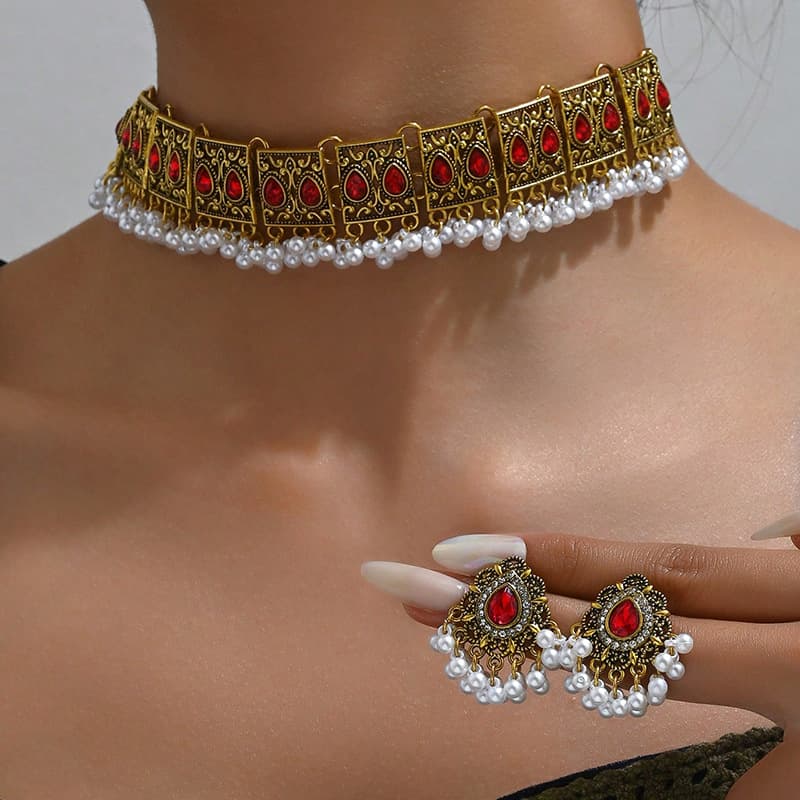 Juego de collar y aretes con diseño de alas de pavo real