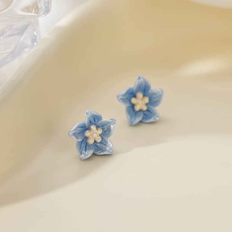 Aretes de flor azul delicados