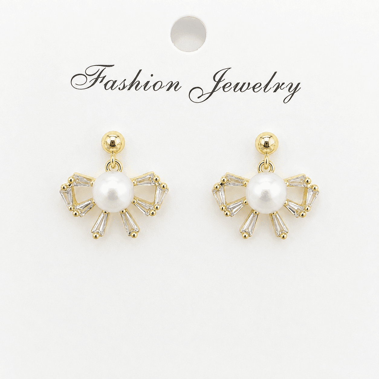 Aretes de perlas con moño de circonia