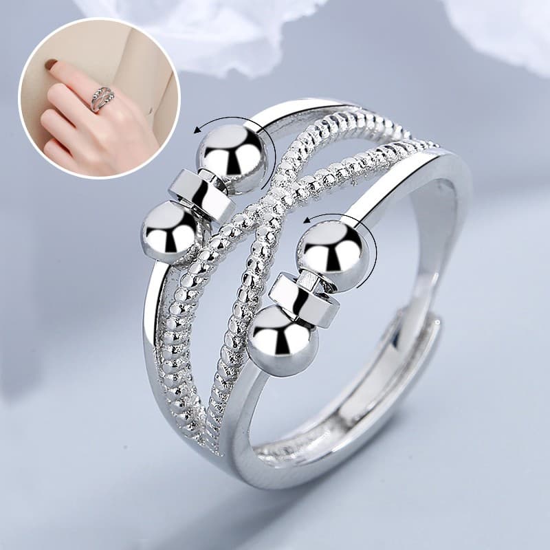 Anillo rotatorio abierto de doble capa para aliviar ansiedad