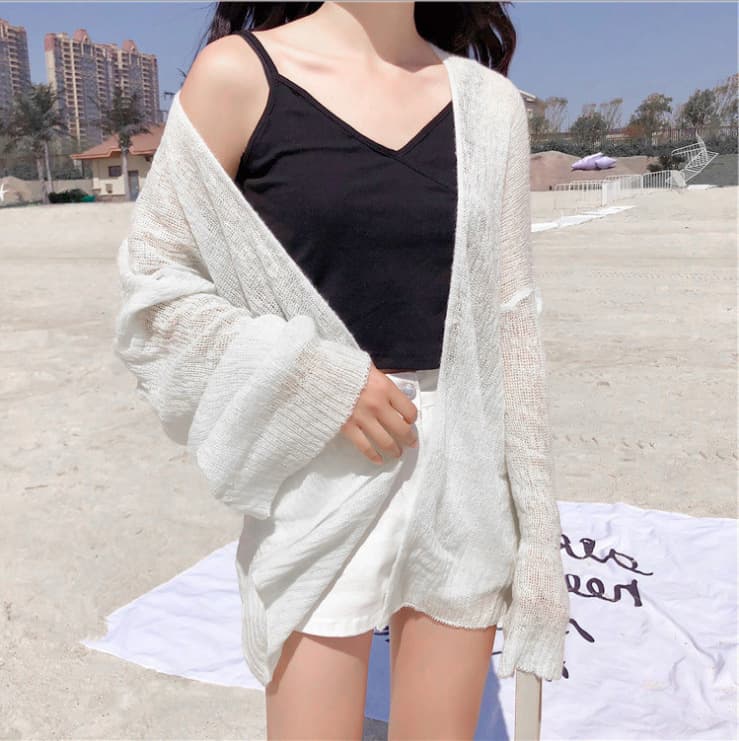 Cardigan corto tejido con protección solar