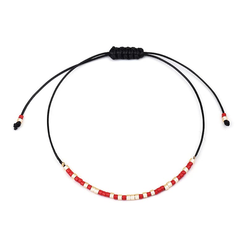 Pulsera tejida hecha a mano con perlas y cordón encerado