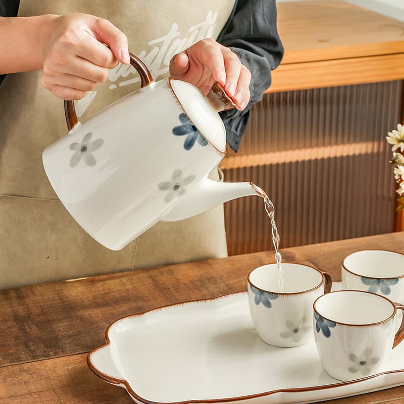 Juego de té de cerámica con taza y tetera artesanal