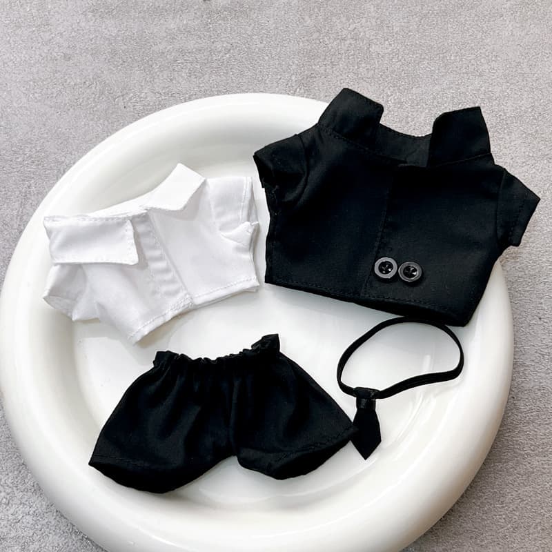 Conjunto de traje negro con gafas de sol para muñecas