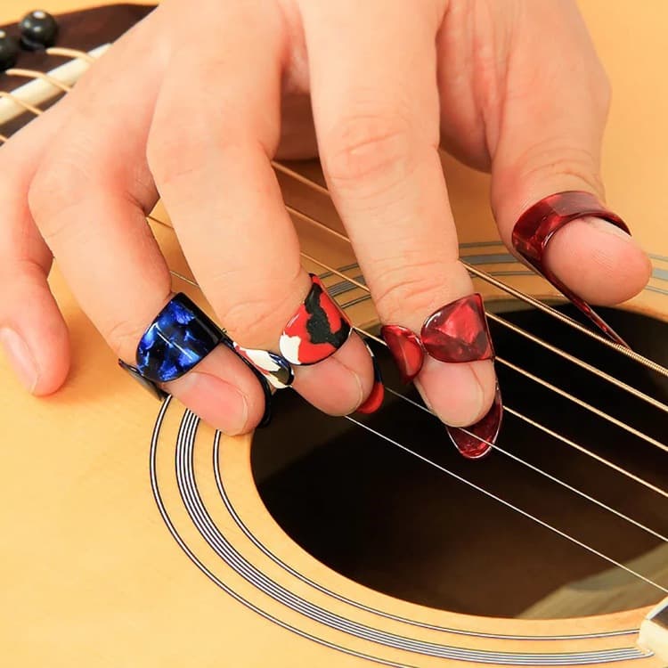 Púas de guitarra para dedo y pulgar