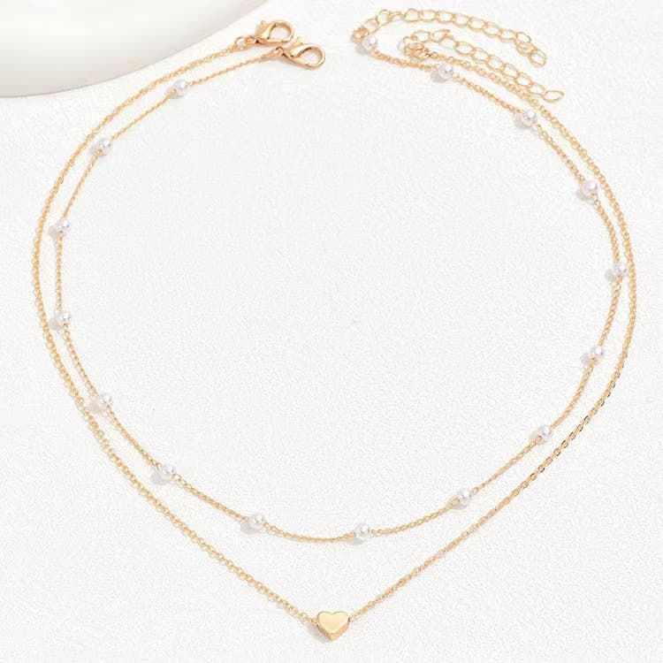 Collar de corazón doble con perlas