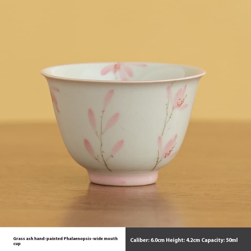 Taza de degustación de cerámica gris con orquídea pintada a mano