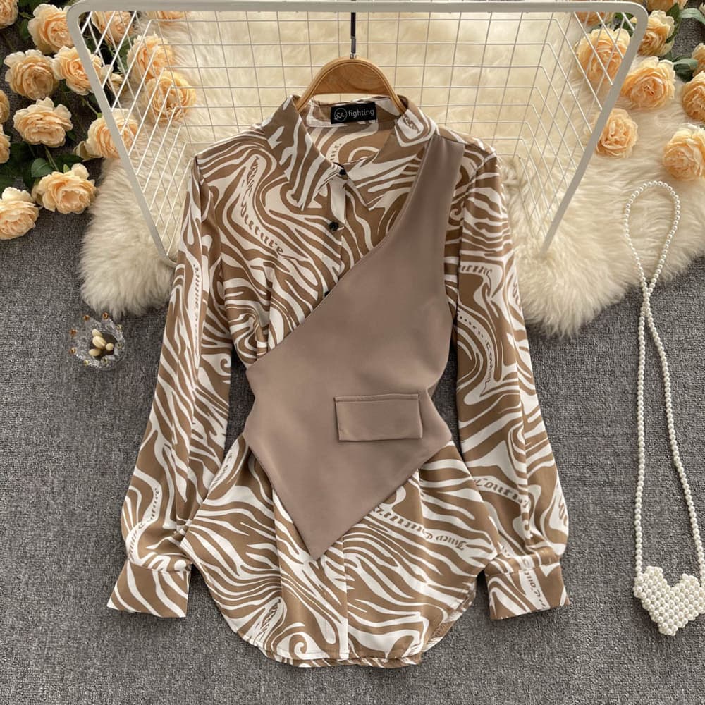 Blusa de manga larga con rayas y costuras decorativas