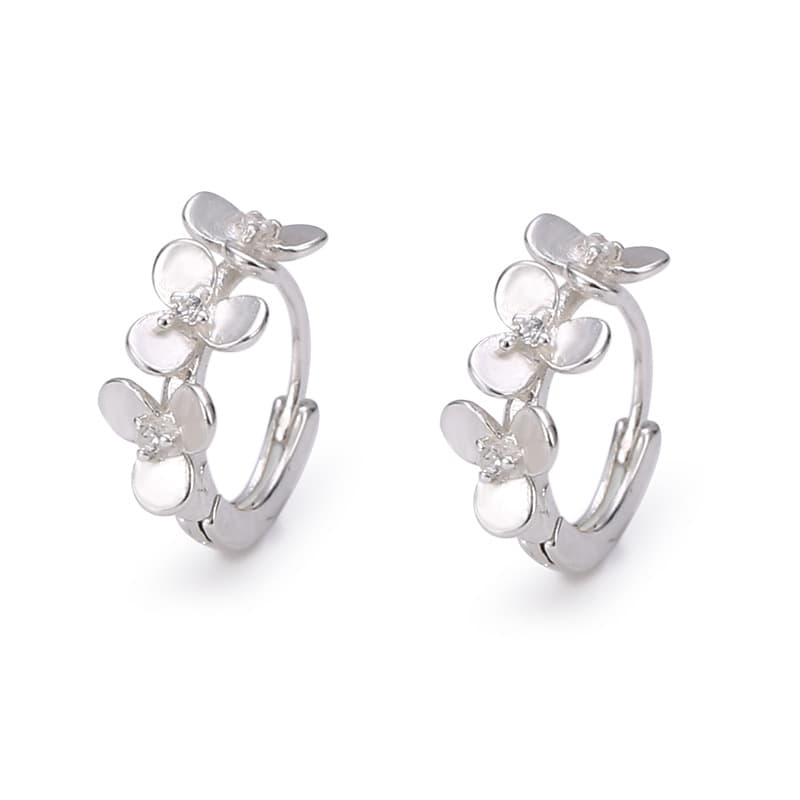 Pulsera y aretes de plata con flor de zirconia