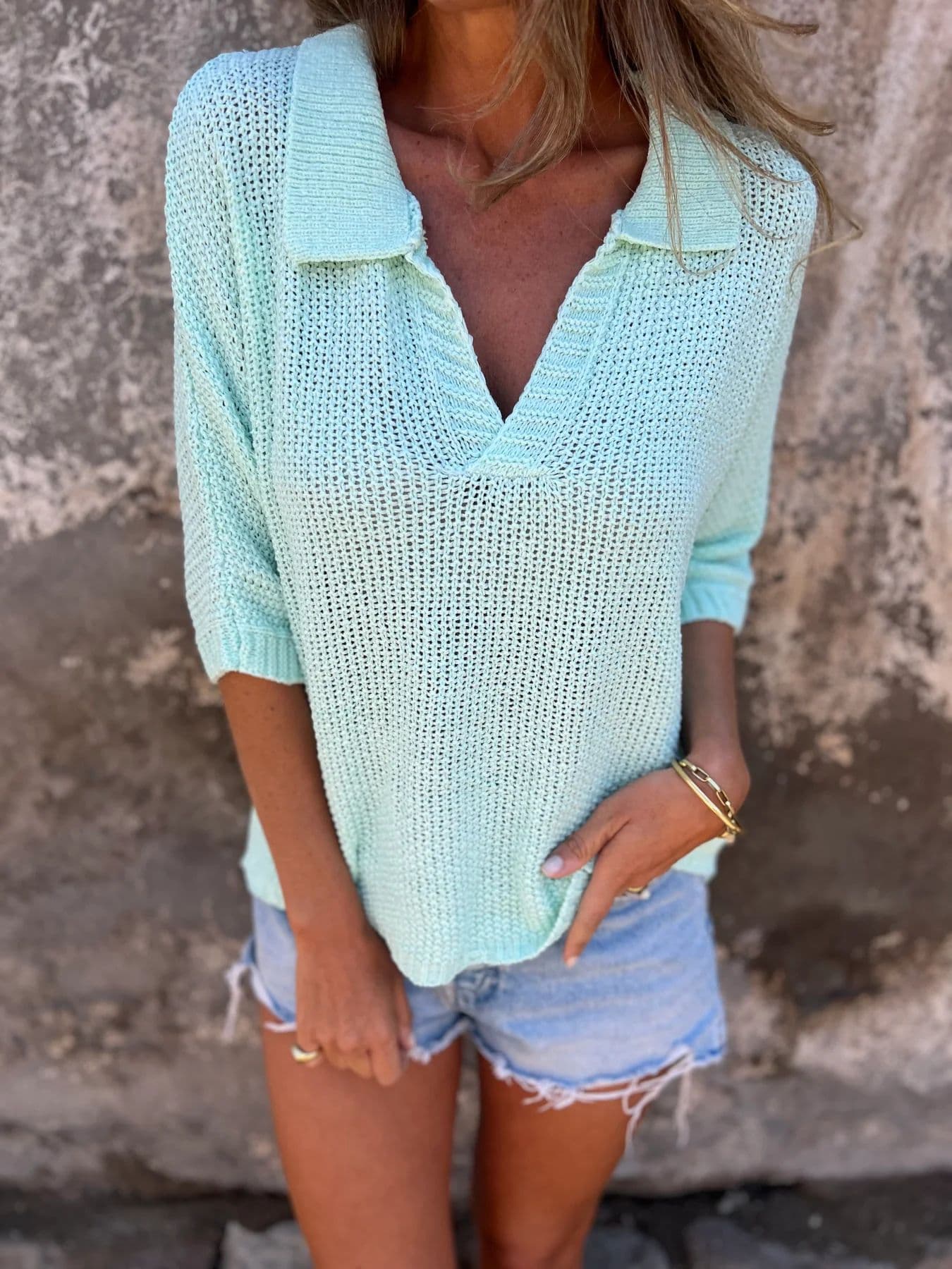 Blusa de punto con solapa y manga tres cuartos