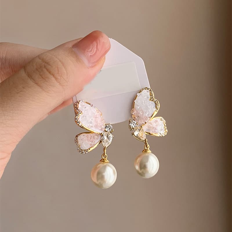 Aretes de mariposa con perlas y rhinestones