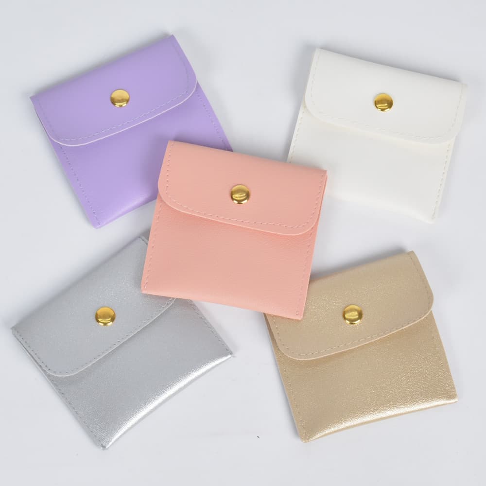 Bolsa de almacenamiento de cuero para joyas con botón