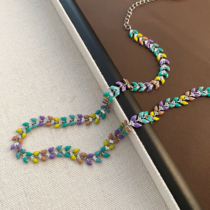 Collar y pulsera de acero titanio con pluma