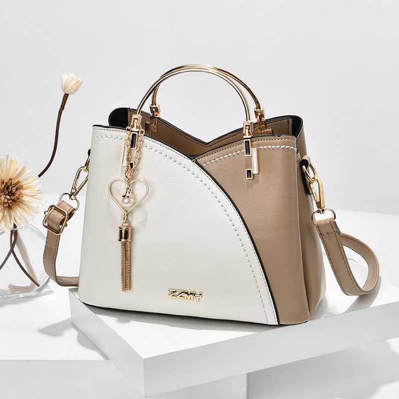 Bolso de mano con bloques de color y tassel