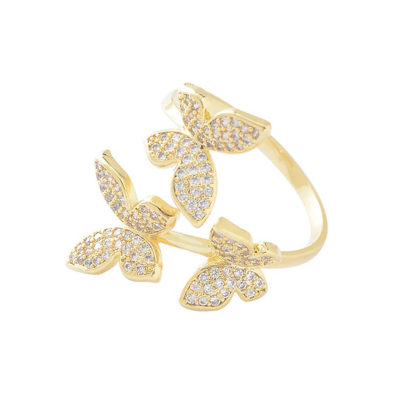 Anillo de mariposa con gemas y acabado dorado