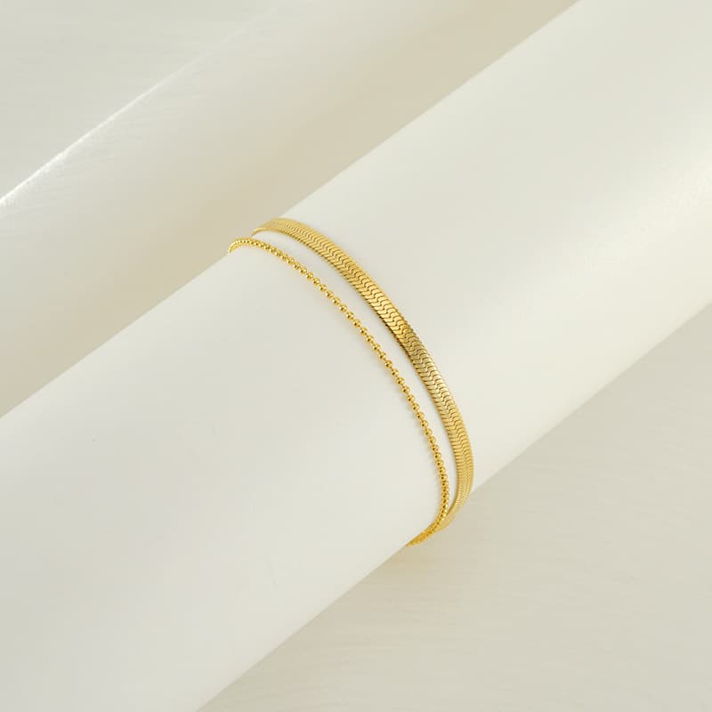 Tobillera titanio con chapado en oro 18K