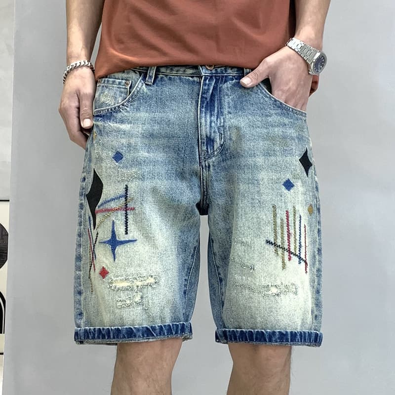 Pantalones de denim bordados cinco puntos