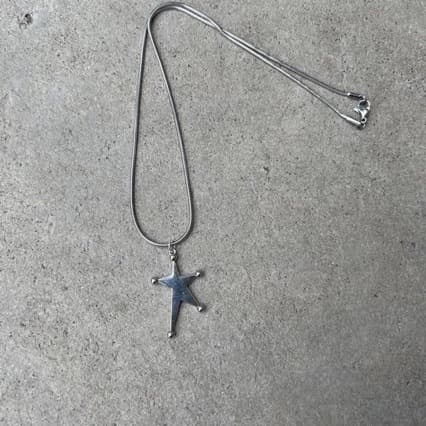 Collar de cruz, estrella y corazón de titanio
