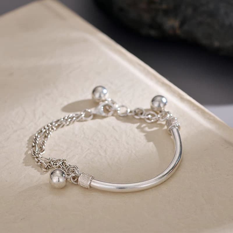 Pulsera plata 999 con semi brazalete y borla