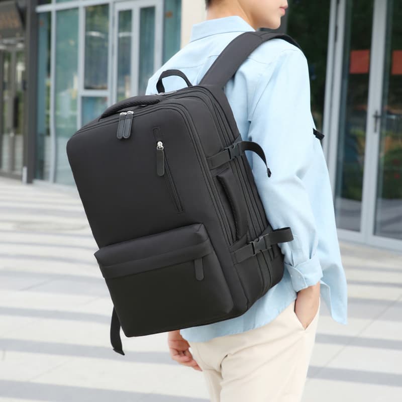 Mochila resistente al agua con puerto USB recargable