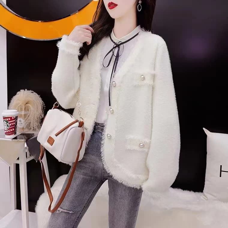 Cardigan vintage suelto con detalles de borlas
