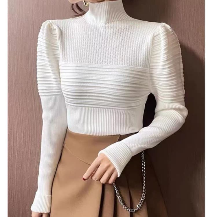 Blusa tejida de cuello alto y mangas abullonadas