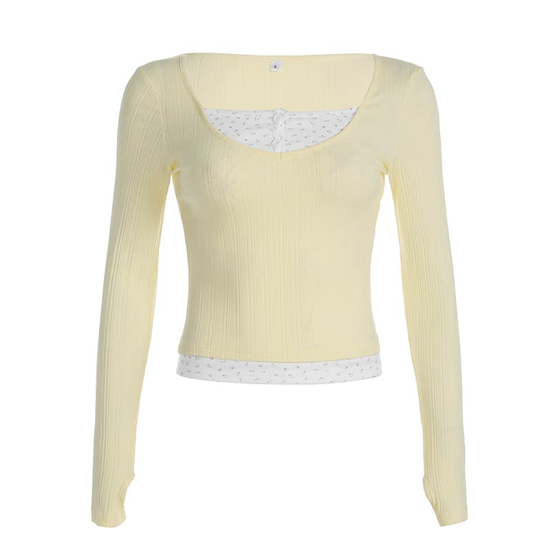 Blusa amarilla de manga larga con detalle floral y efecto dos piezas