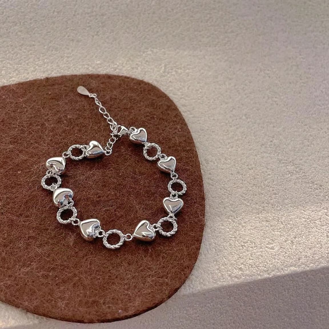 Pulsera de plata esterlina 999 con corazón y eslabones retorcidos