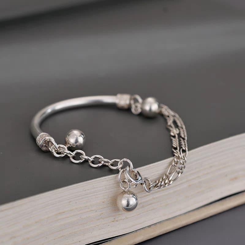 Pulsera plata 999 con semi brazalete y borla