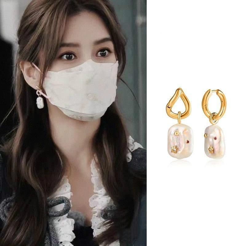 Aretes de perla barroca con circón forma U