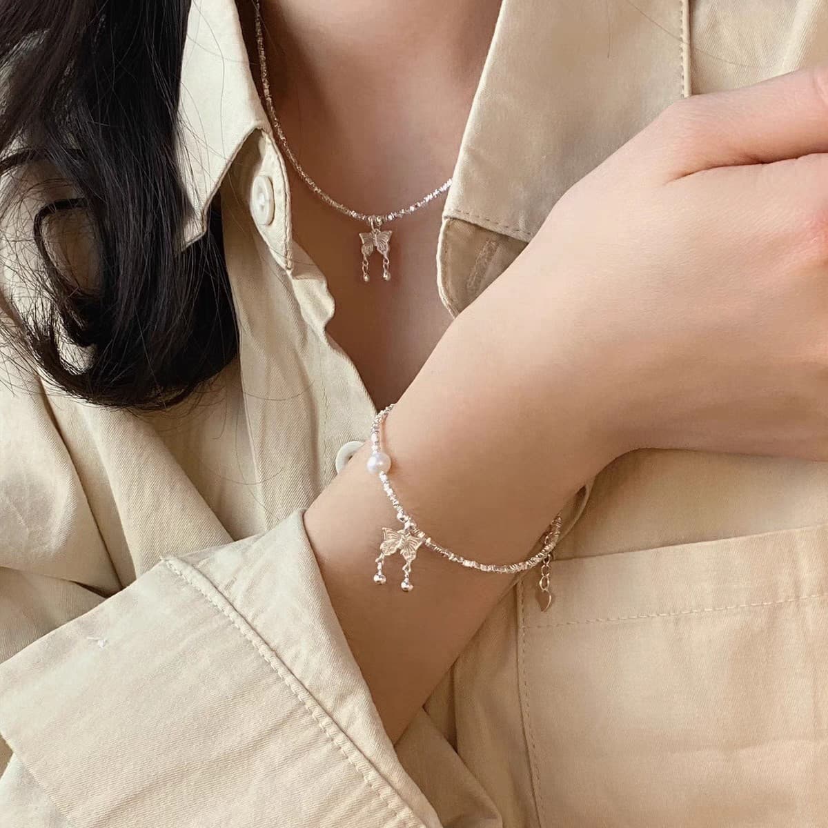 Juego collar y pulsera de plata con perla y mariposa