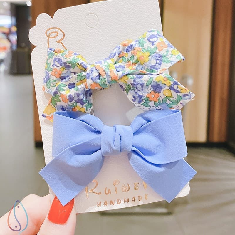 Clip de cabello con diseño de moño para niñas