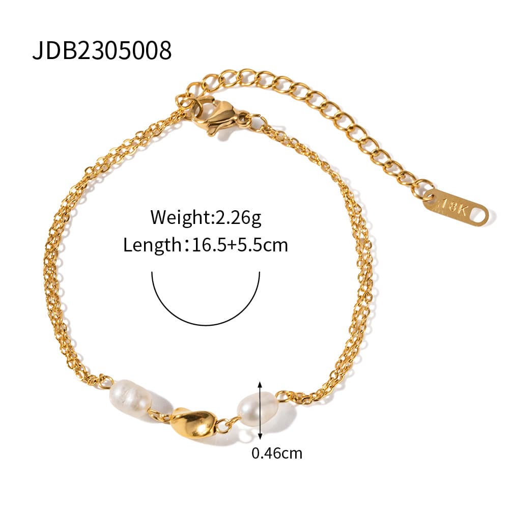 Pulsera de acero inoxidable con detalles de perlas doradas
