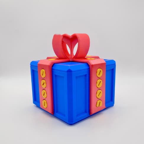Caja de regalo broma con diseño 3D y tornillos incluidos
