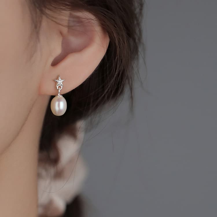 Aretes tipo estrella con perla para mujeres